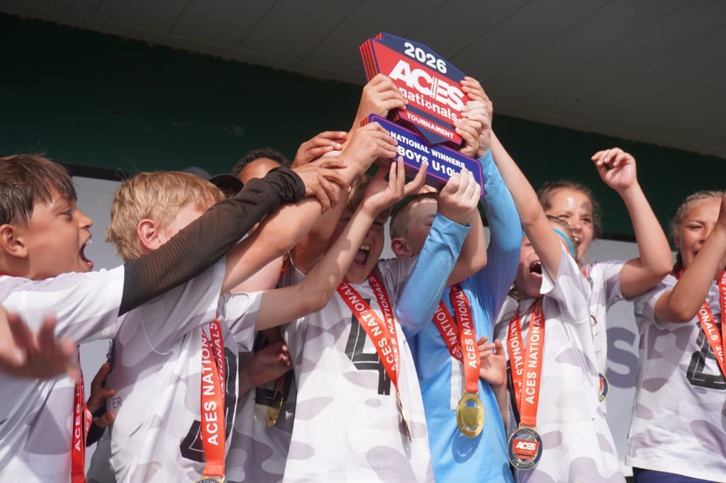 Tournament winners celebrating with trophy